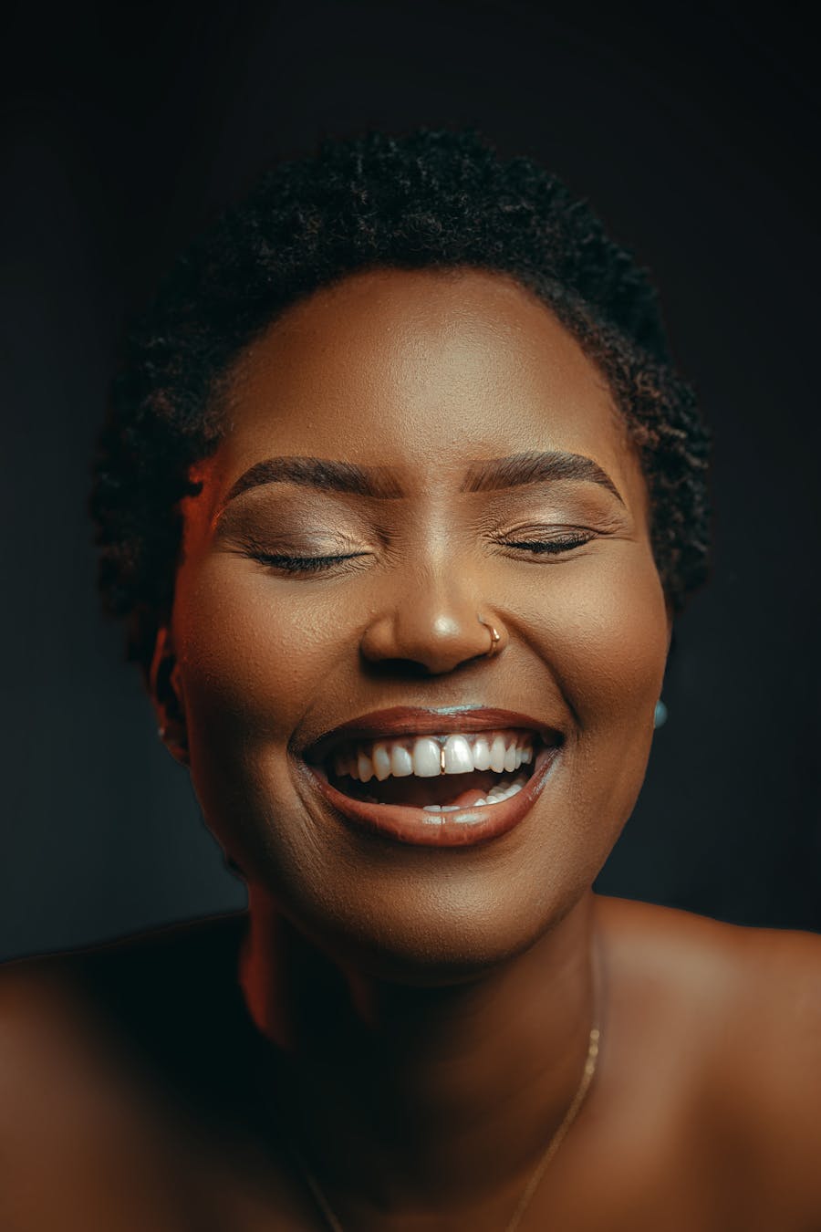 A woman laughing joyfully